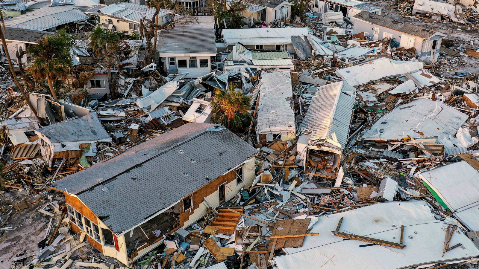 Heavily damaged mobile homes in Fort Myers Beach, Florida a month after Hurricane Ian.