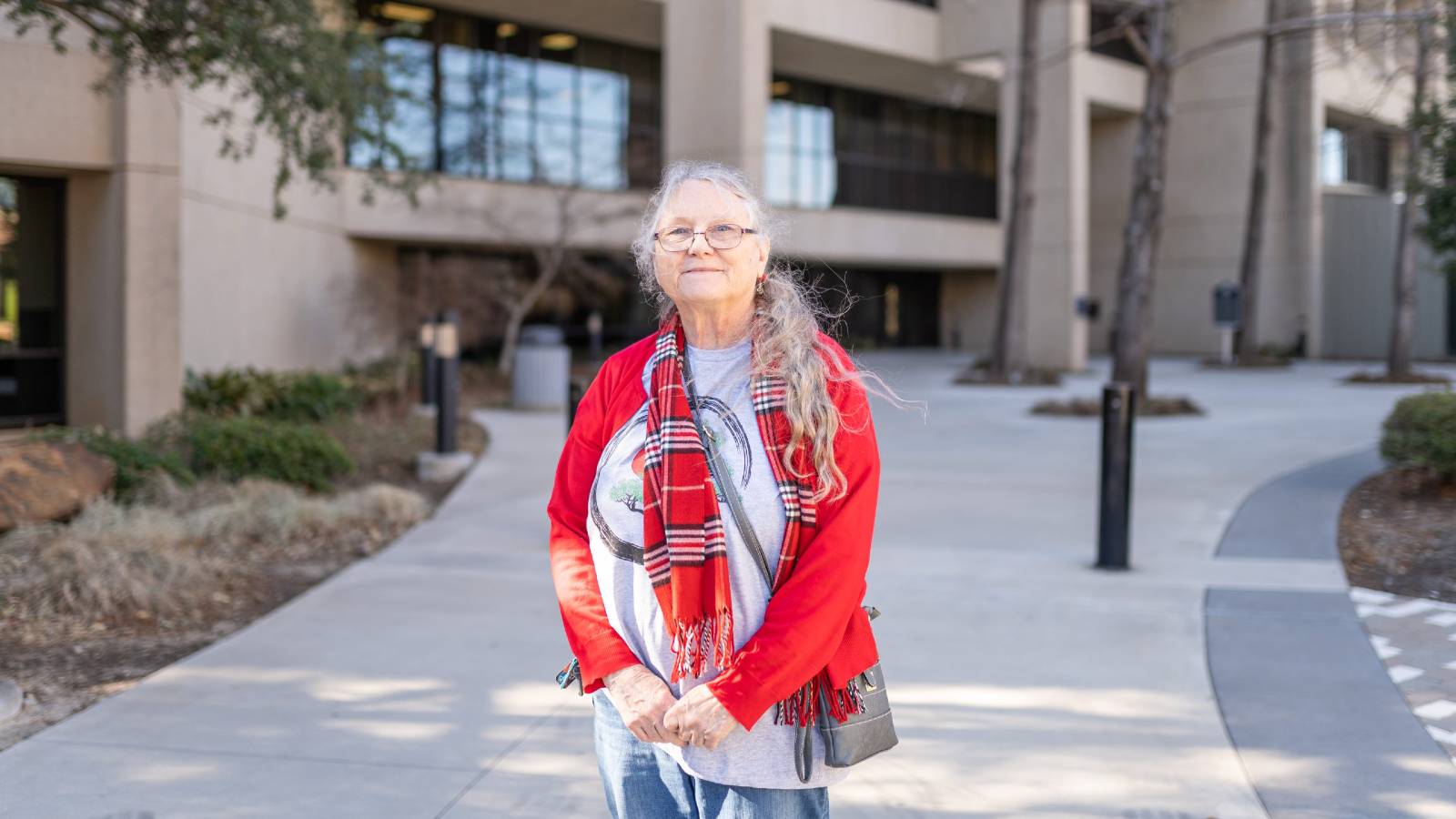 A volunteer for Liveable Arlington smiles.