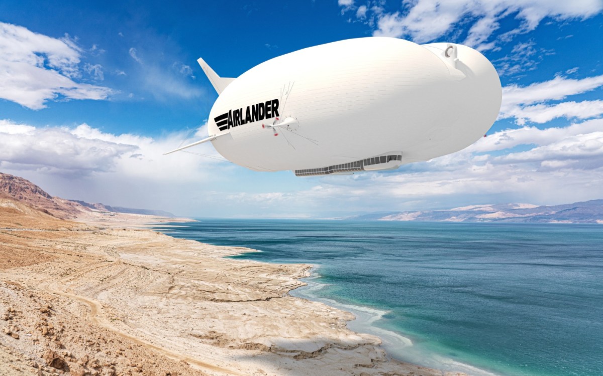 An image of the Airlander 10 floating over the coastline. 