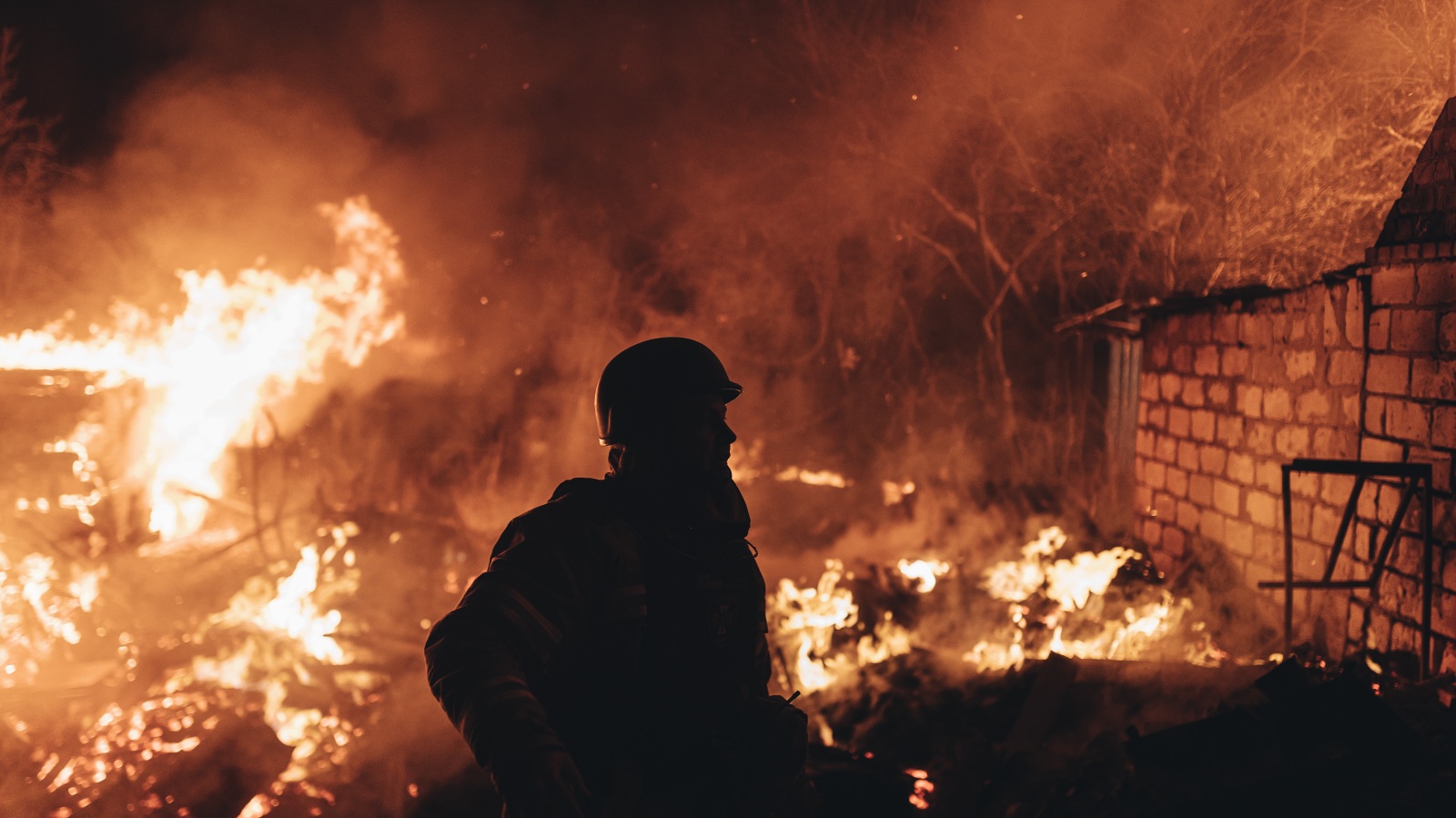 Emergency workers extinguish fire after shelling in Ukraine