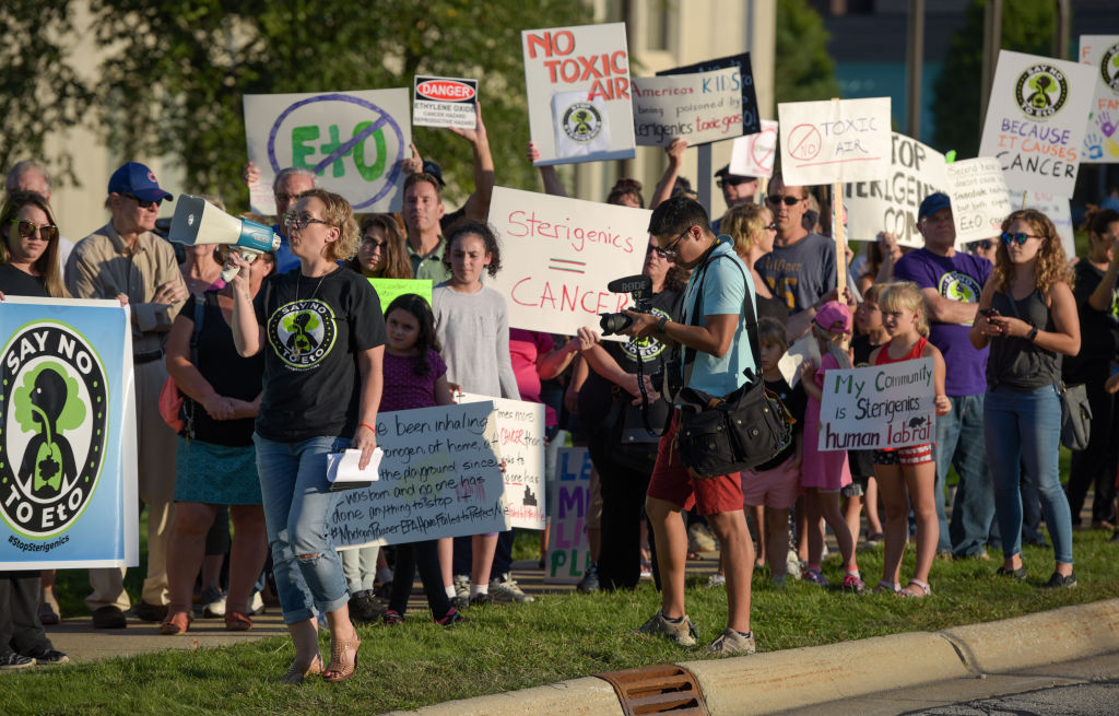 Protesters chanting and holding signs