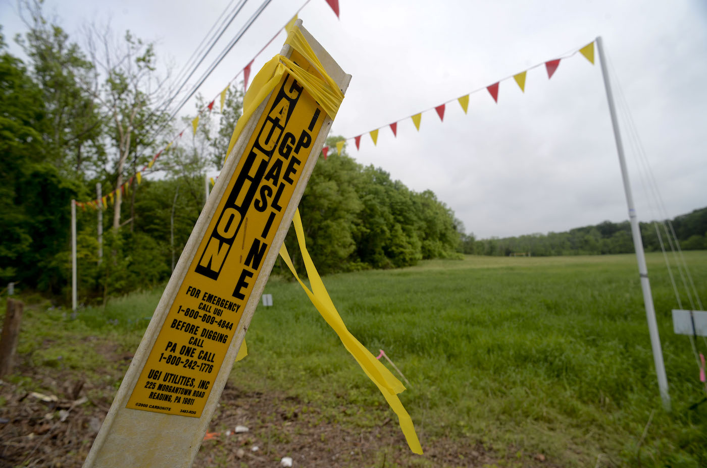 post in the ground cautioning that a gas pipeline is buried there