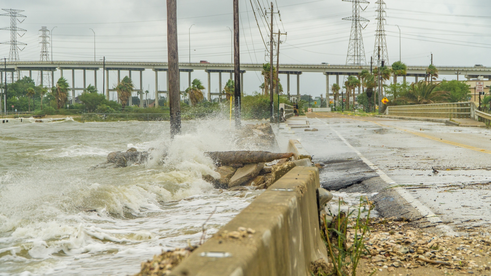 Water crashing over a road near Galveston Bay outside of Houston.