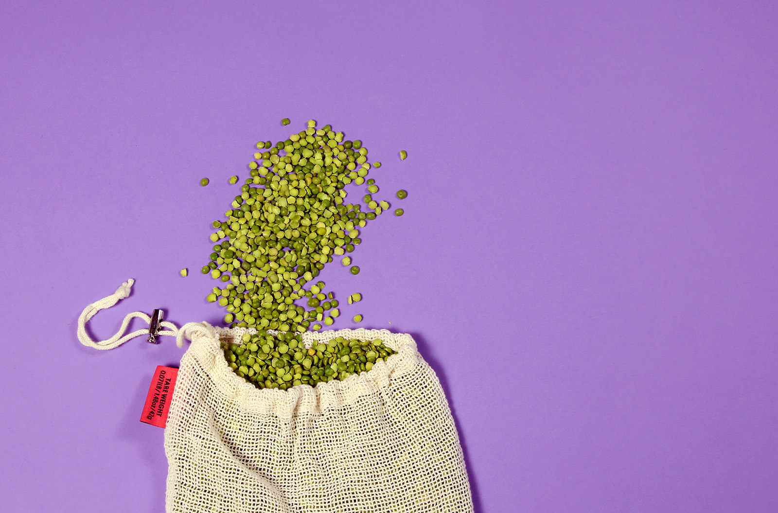 Reusable bag with lentils spilling out