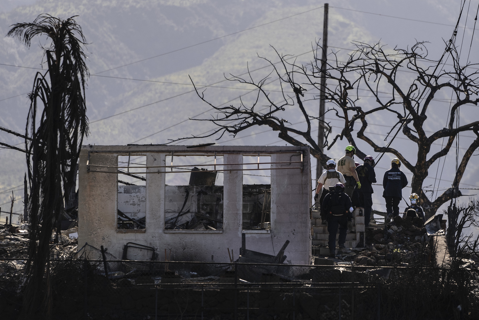 a burned house with rescule crew