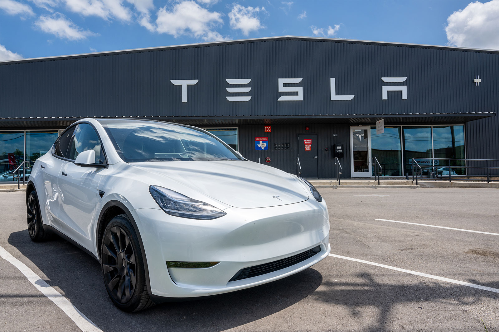 A white Tesla Model Y is seen on a Tesla car lot on May 31, 2023 in Austin, Texas