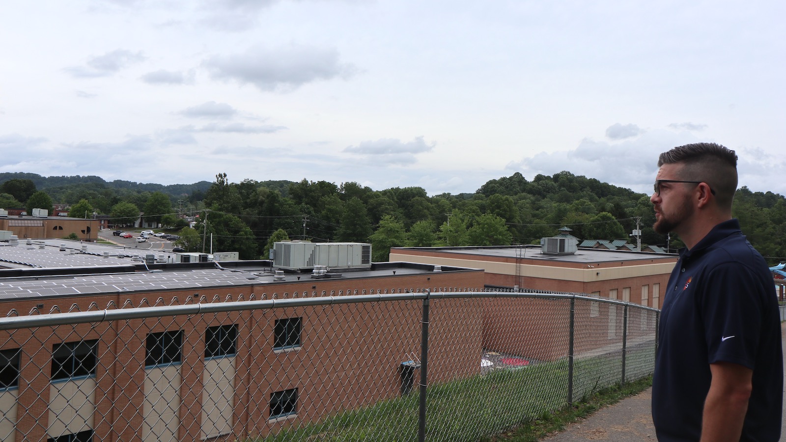 Matt McFadden looks out onto the solar array his company erected on Wise Primary School in Wise, Virginia.