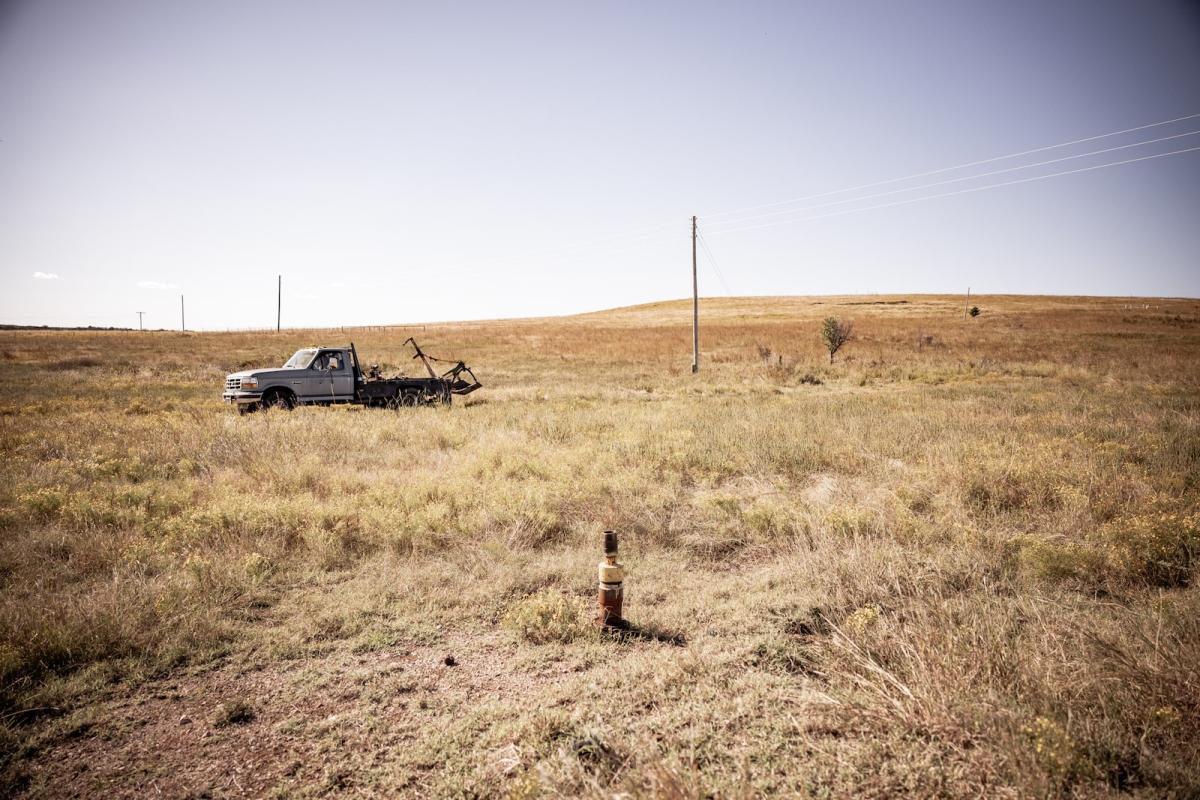 A truck near an oil well in Osage County