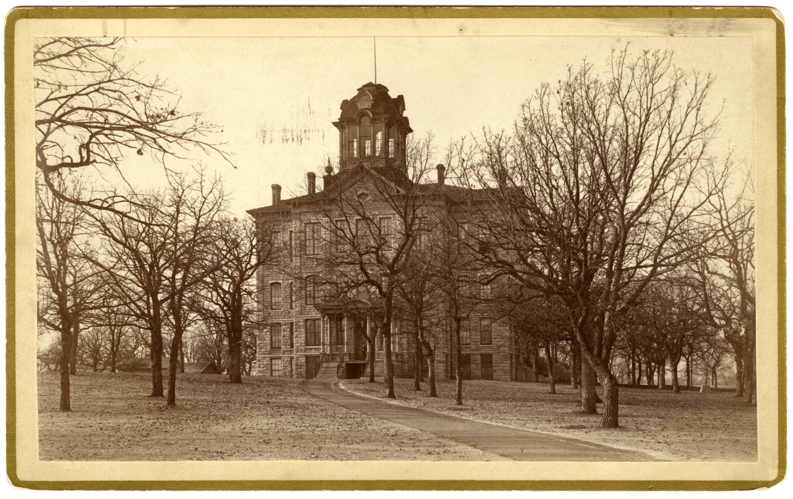 an old brick building in a historic photo