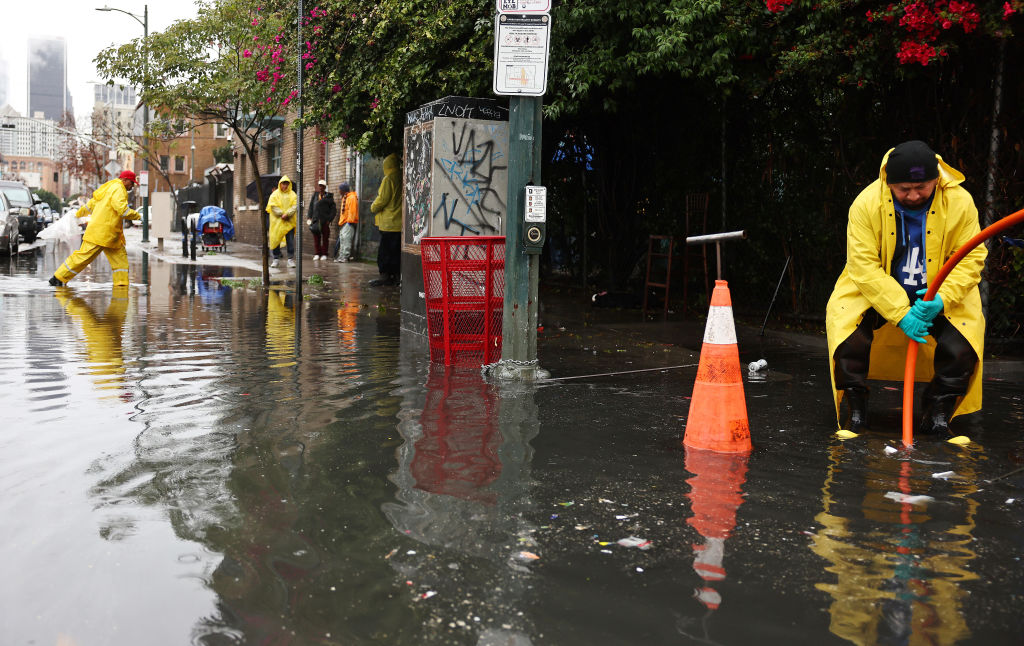 Man in yellow boots in floodwater