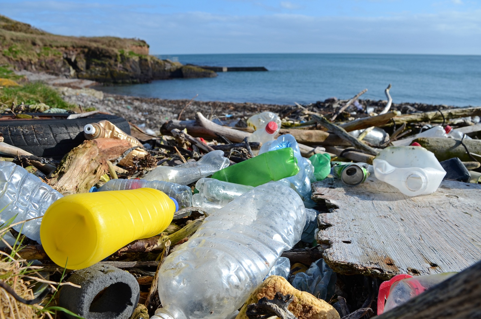 Beach with plastics strewn around