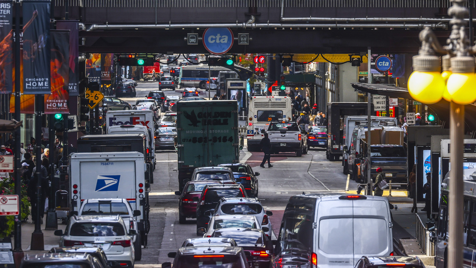 cars and trucks in traffic jam in urban setting