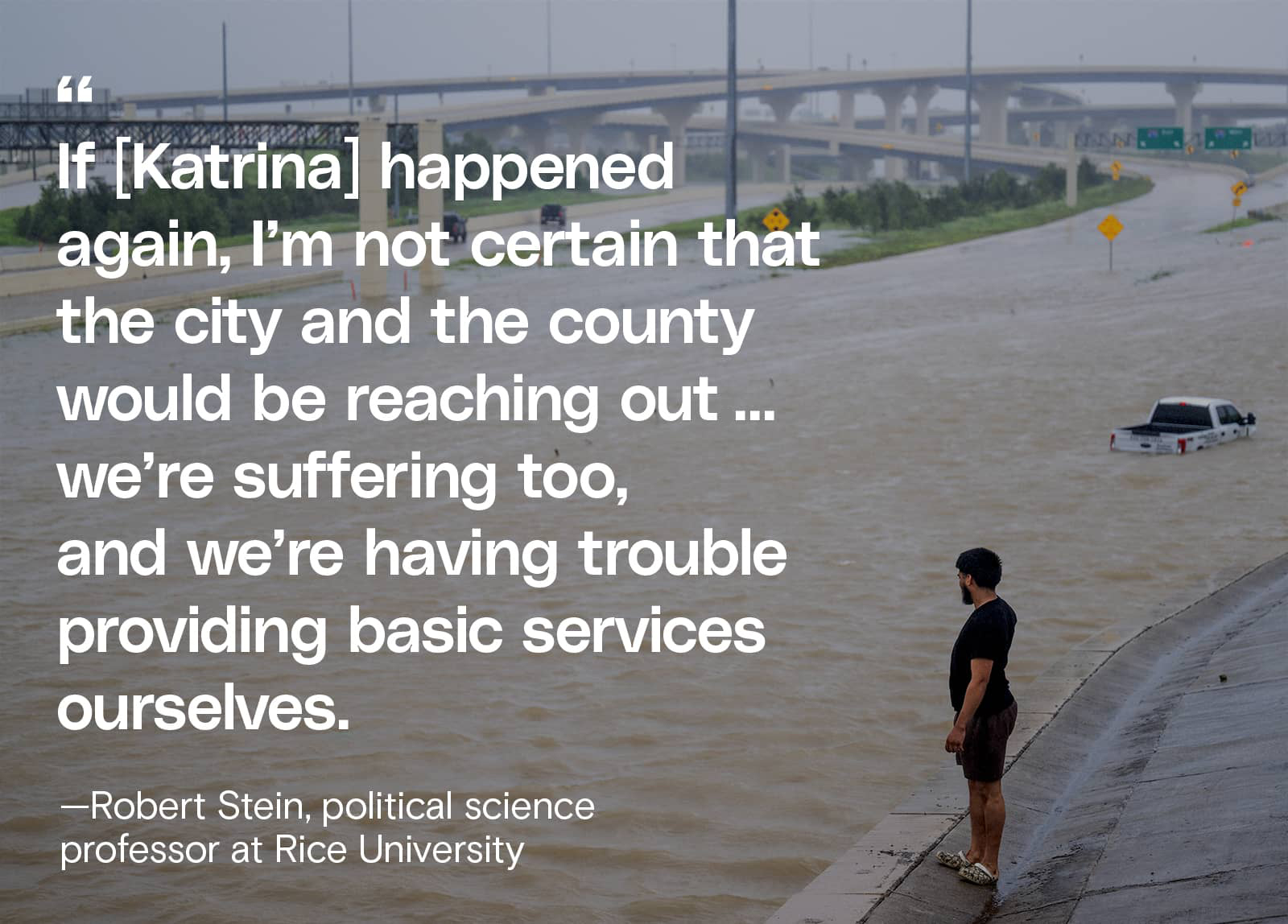 A person looks out towards the flooded interstate after Hurricane Beryl swept through the area on July 08, 2024 in Houston, Texas.