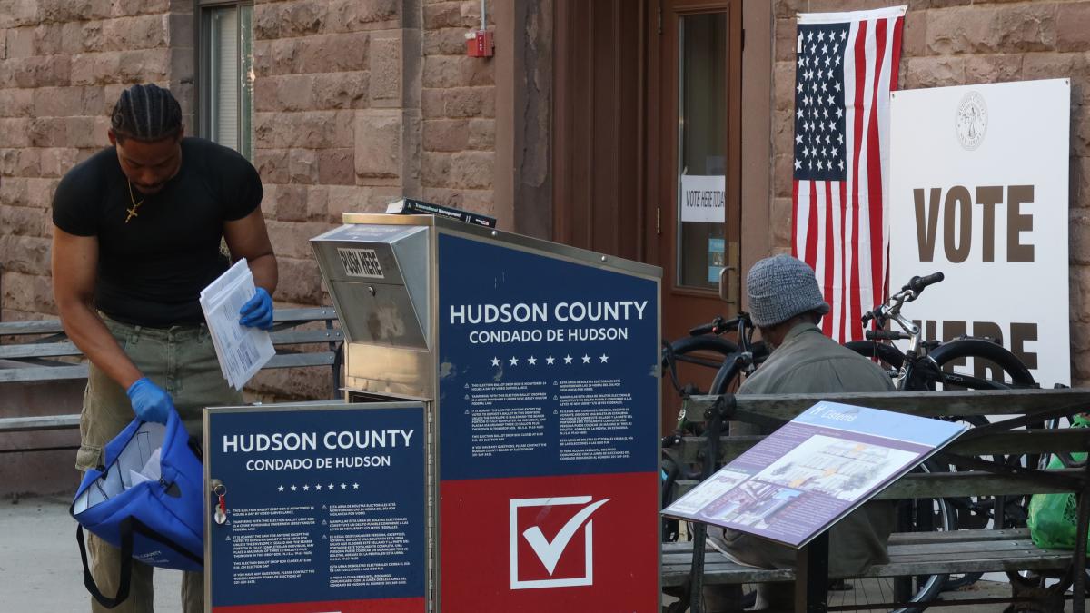 A poll worker collects mail in ballots from a drop box for the New Jersey primary election on June 4, 2024, in Hoboken, New Jersey