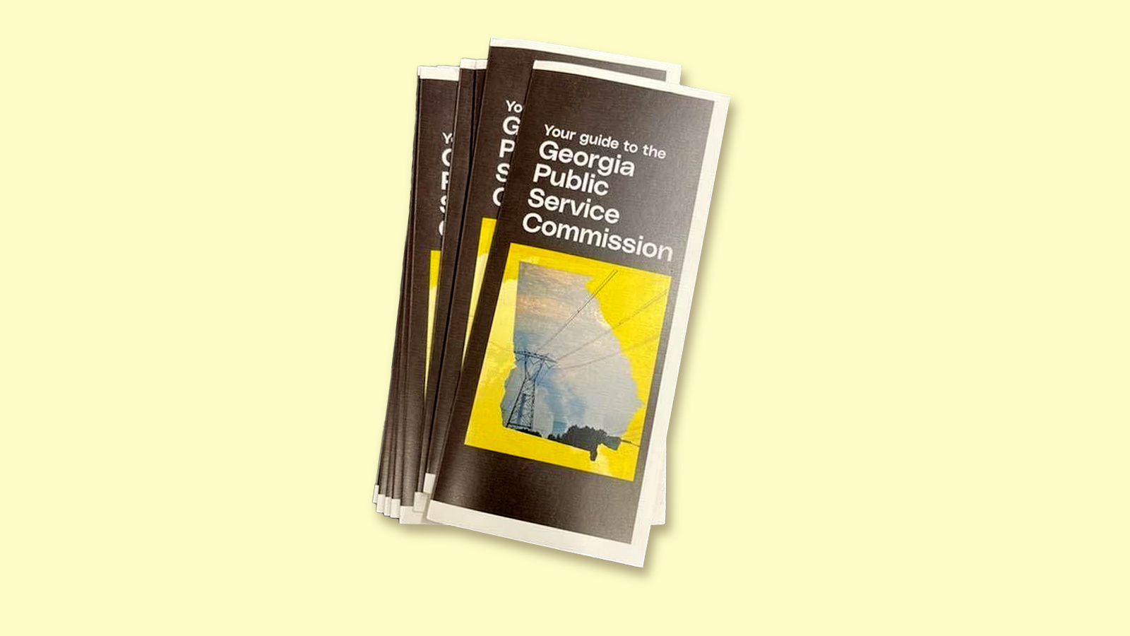 A pile of brochures that read Georgia Public Service Commission on a yellow background